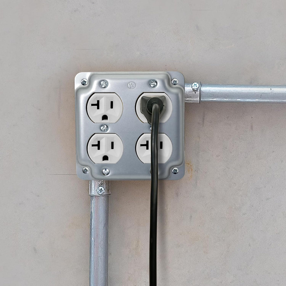 Double-duplex raised cover installed on a 4-inch square electrical box