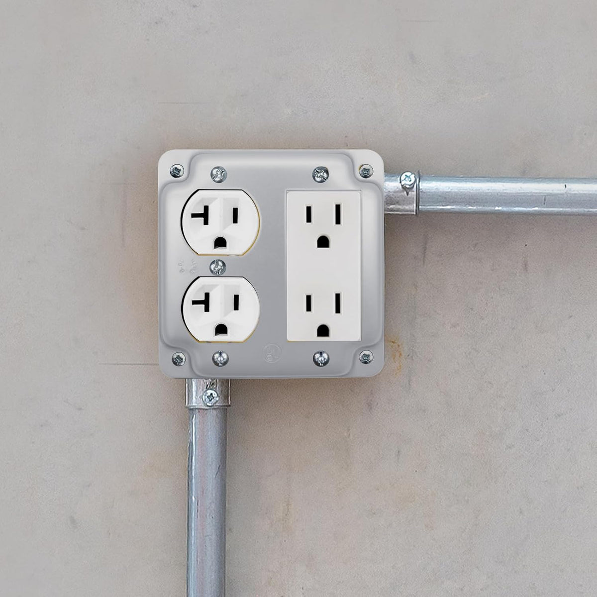 Duplex and decorator raised cover installed on a 4-inch square electrical box