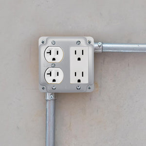 Duplex and decorator raised cover installed on a 4-inch square electrical box